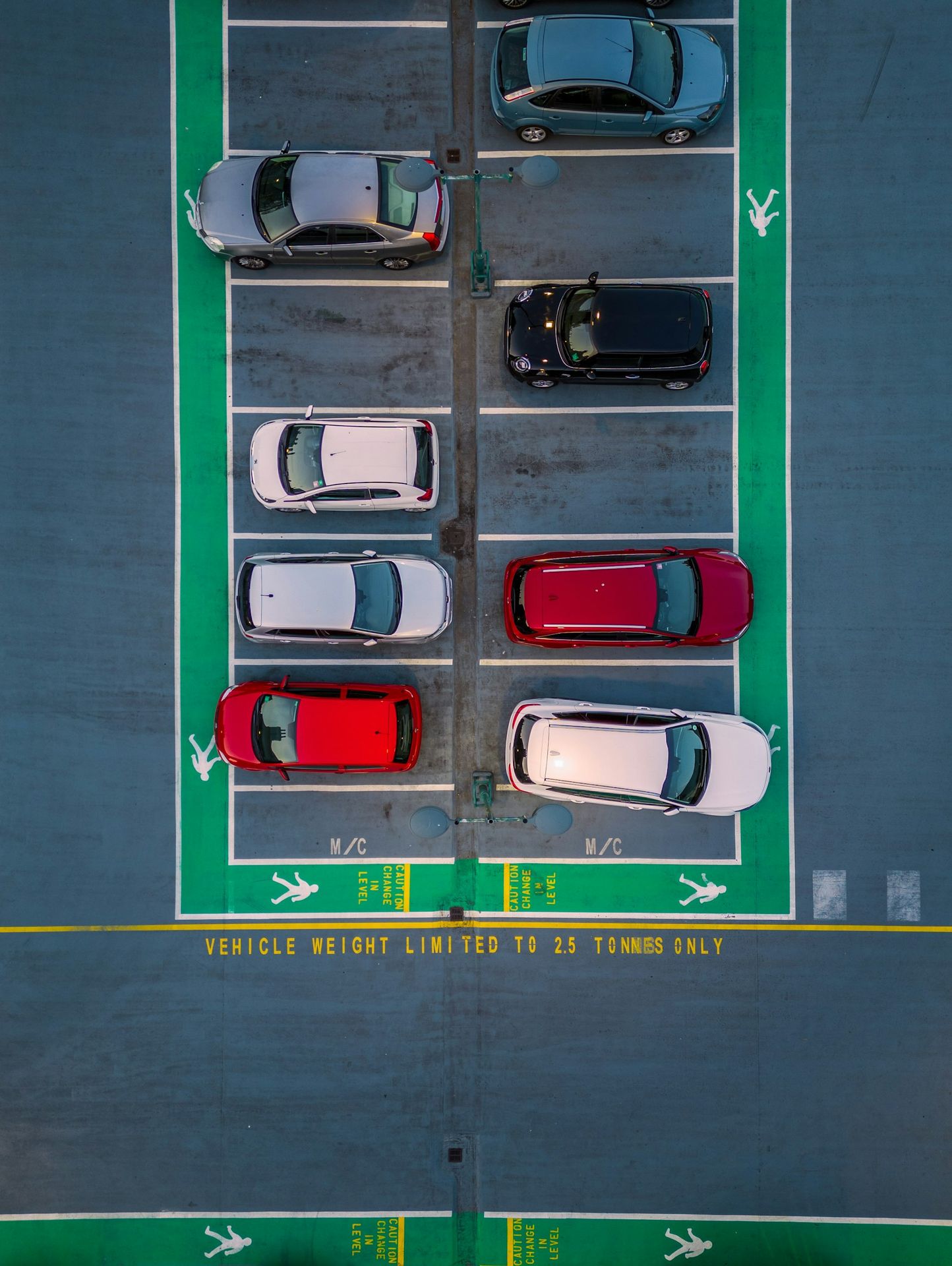a parking lot with several cars parked in it